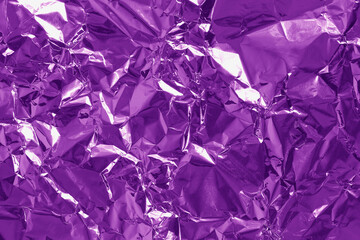 Purple foil texture background, pattern of wrapping paper with crumpled and wavy.