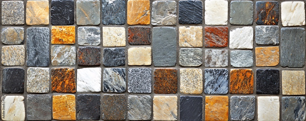 Poster Mosaic stone tiles creating a varied and colorful pattern