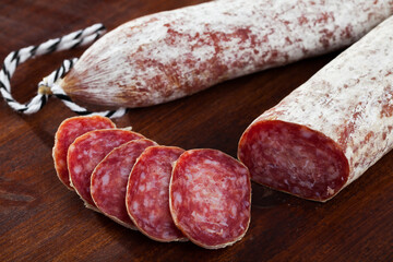 Spanish jerked pork sausage Longaniza on cutting board