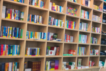 Blurry Library background off white Backdrop bright softness bookshelf with copy space. Book case Blurred background bright library silver gray lighting. defocused store light bokeh in design
