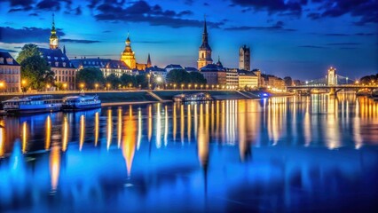Obraz premium Dark blue Elbe River at night with twinkling city lights reflected on the water , city, night, city