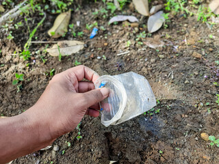 Hand Collecting Plastic Waste for Environmental Cleanup