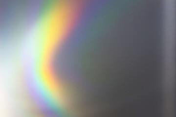 Rainbow reflection of light on the wall.