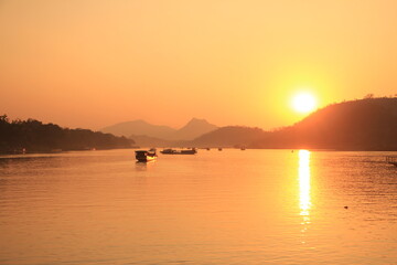 Fototapeta premium Sunset Boat Cruise on Nam Ou River in Luang Prabang, Laos
