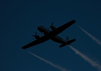 Twin Propeller Plane Silhouette at Dusk