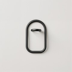 minimalist and modern design of a black metal hook. The hook is U-shaped with two rounded ends, giving it a sleek and simple appearance.