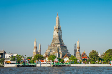 Wat Arun Buddhist temple on the bank of the Chao Phraya River early morning. Best known of Thailand's landmarks in Bangkok