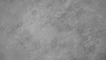 Above view of cement or concrete a rough textured surface. With visible grains and subtle variations in color and texture. The overall impression is one of industrial and utilitarian simplicity.