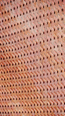 The intricate brick pattern creates a dynamic texture, blending traditional material with modern design.