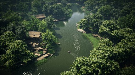Fototapeta premium Tranquil River Scene Surrounded by Lush Green Forest with Rustic Houses and a Person in a Small Boat