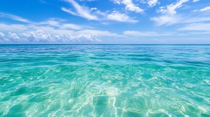 Crystal clear turquoise ocean waters under a bright blue sky with fluffy clouds creating a serene atmosphere : Generative AI