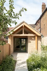 The entrance of a contemporary brick house is beautifully framed by lush greenery, creating a picturesque scene in a vibrant residential neighborhood on a bright, sunny day