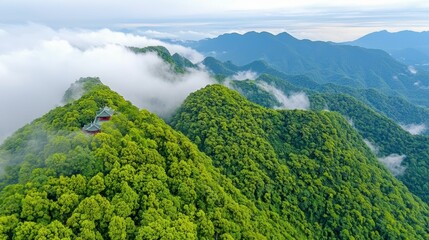 Verdant Mountain Peaks with Mist and Temple View