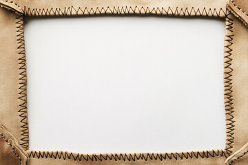 beige leather frame with stitched edges isolated on white background  for text or image