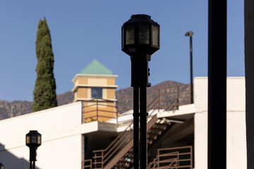 A historic street lamp frames the downtown skyline of Burbank, California, USA.