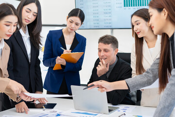  Group of business people working together in a modern office.