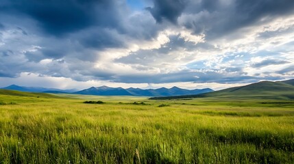 Obraz premium Majestic view of vast green fields and rolling mountains under a dramatic cloudy sky : Generative AI