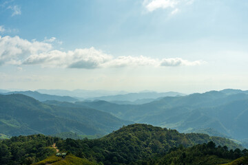 Natural view countryside of mountain forest with blue sky background. Nature rainforest landscape.