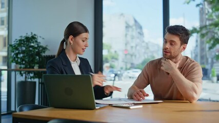Confident businesswoman explaining project to man sitting office laptop closeup.