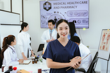 A diverse team of doctors and nurses work together in a hospital office and talk to each other. Teamwork and dedication to providing quality healthcare and medical solutions.