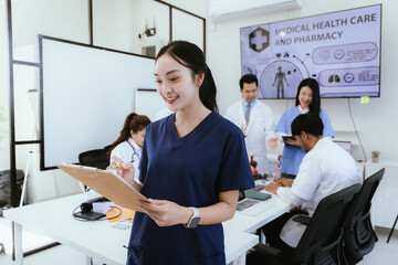 A diverse team of doctors and nurses work together in a hospital office and talk to each other. Teamwork and dedication to providing quality healthcare and medical solutions.