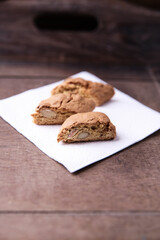 Cantuccini (Italian cookies) on dark wooden background. Close up	