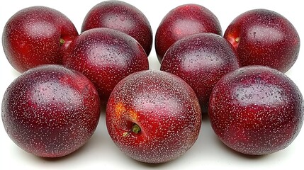 A vibrant arrangement of fresh, glossy plums showcasing their rich color and texture
