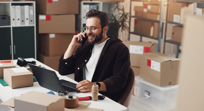 Happy businessman, laptop or logistics with phone call for online order or customer service at storage warehouse. Man, distributor or employee talking with smile on mobile smartphone for distribution