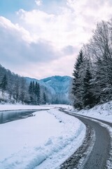 Serene Winter Landscape with Snow-Covered Road and River Scene