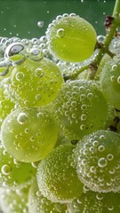 green grapes covered with bubbles in sparkling water