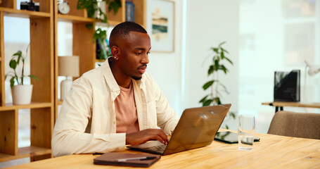 Laptop, creative business and black man typing in startup office, research and blog for social...