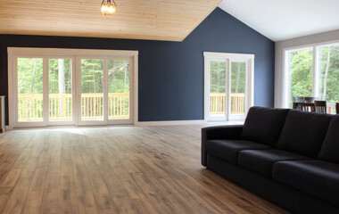 Spacious living room with natural light and modern decor in a tranquil setting