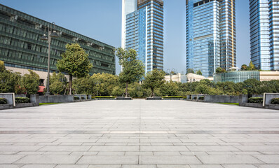 Modern Urban Plaza Surrounded by Skyscrapers and Greenery