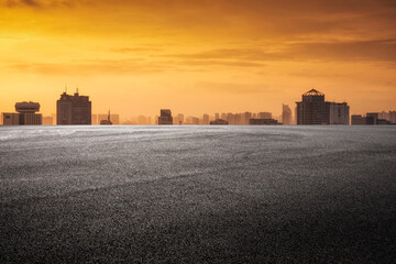Serene Urban Sunset Over a Cityscape with Dramatic Skies
