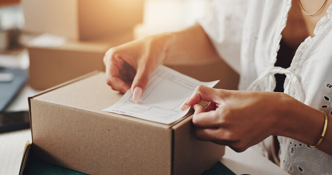 Hands, woman and box with label for distribution of online orders, invoice and shipping information. Person, packaging and ecommerce receipt for package delivery, payment sticker and small business