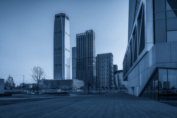 Fototapeta premium Modern Urban Landscape in Blue Monochrome Under Clear Sky