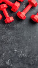 Red dumbbells on dark surface, fitness, workout, healthy lifestyle, gym equipment, background space
