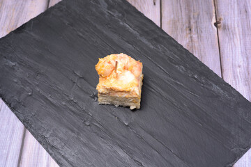 prawn canape on black slate tray on wooden table