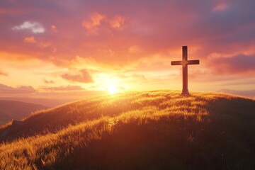 A traditional wooden cross stands tall on a hill at sunset.