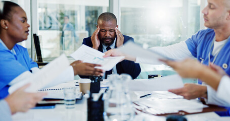 Frustrated man, doctor or headache with documents in meeting for overworked stress or anxiety at...