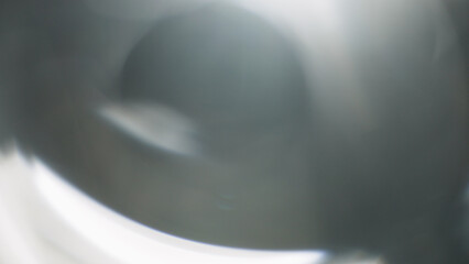 Real lens flare from optics with bokeh and obstruction on foreground