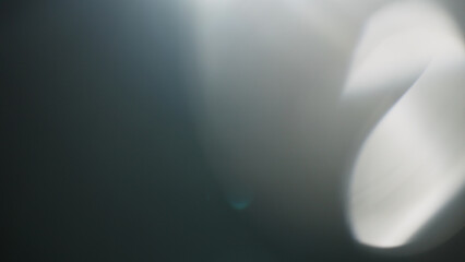 Real lens flare from optics with bokeh and obstruction on foreground