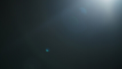 Real lens flare from optics with bokeh and obstruction on foreground