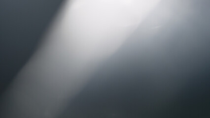 Real lens flare from optics with bokeh and obstruction on foreground
