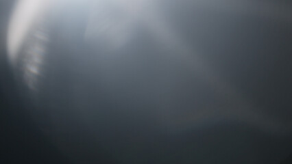 Real lens flare from optics with bokeh and obstruction on foreground