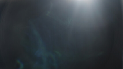 Real lens flare from optics with bokeh and obstruction on foreground