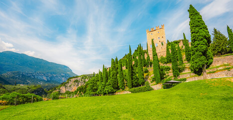 Arco castle ruins on cliffs above Garda lake, Trentino, Italy. Lago di garda