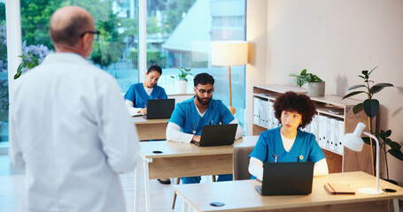 Fototapeta premium Healthcare, students and doctors with test, studying or knowledge of diseases, listening and classroom. Education, learning and people with info for medicine, laptop or skills for license in hospital
