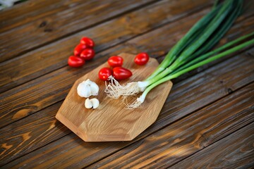 Fresh Vegetables on a Wooden Cutting Board