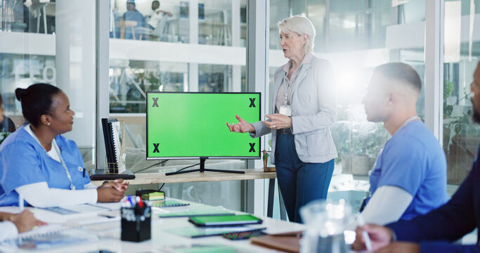 Doctor, coach and team with green screen for presentation, medical training or conference at hospital. Mentor, leader or speaker with healthcare group, tracking markers or mockup space for meeting - Powered by Adobe